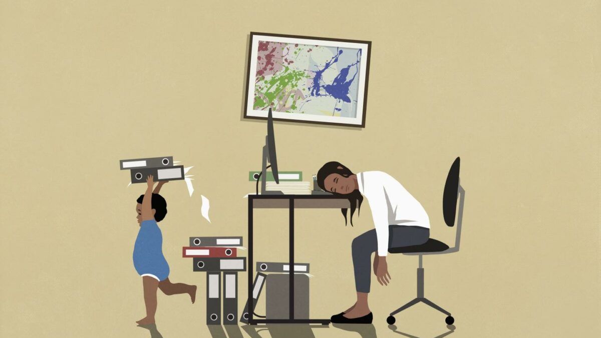 Exhausted businesswoman sleeping at desk in home office with playing son