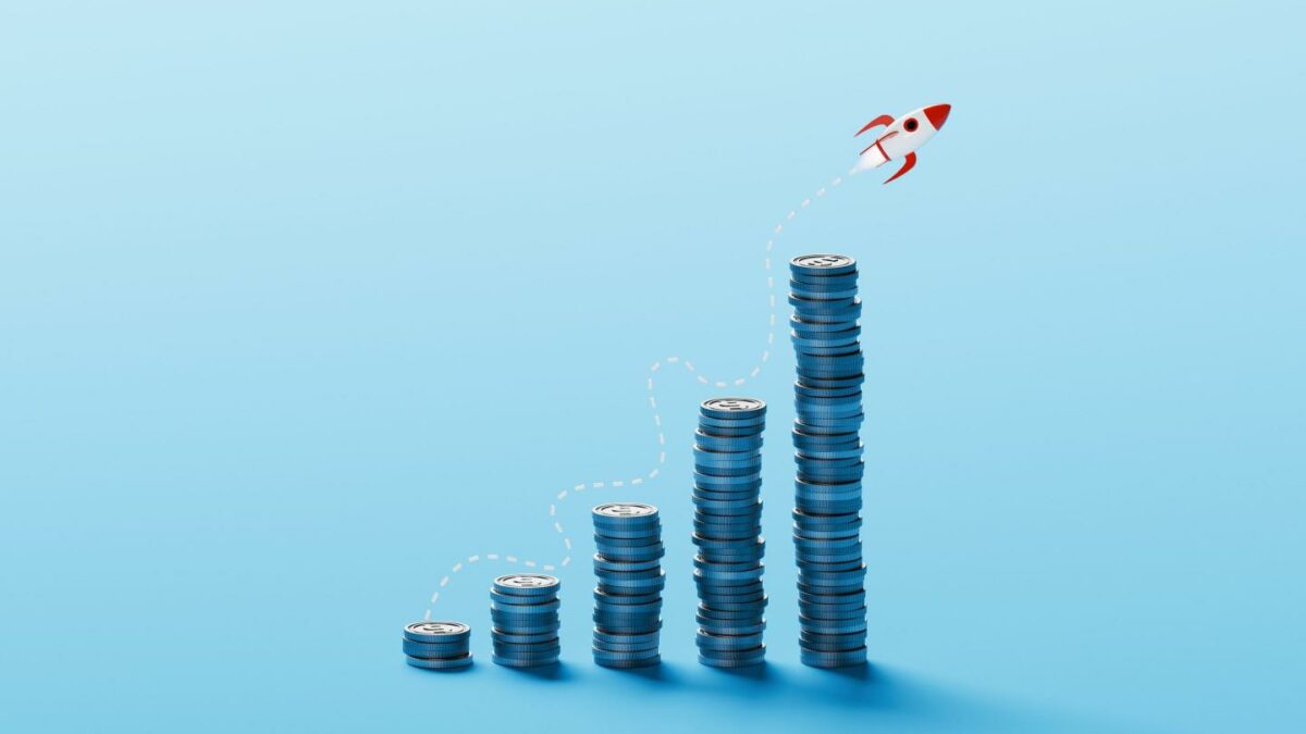 A bar chart with coins going up and to the right.