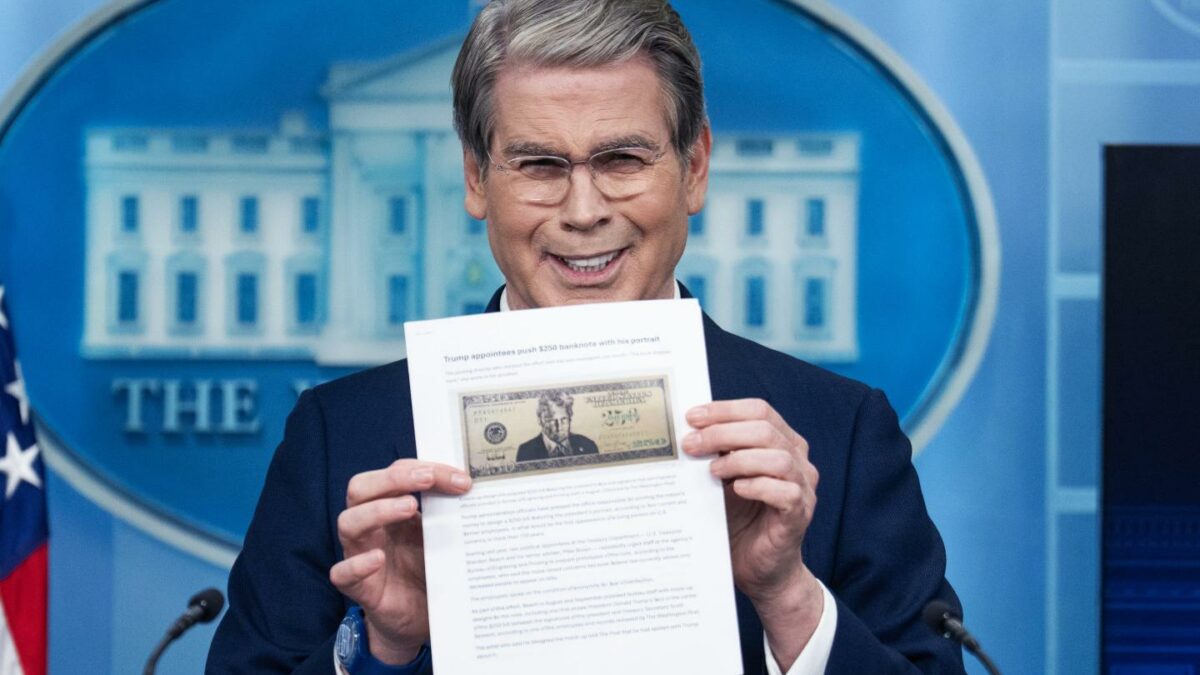Treasury Secretary Scott Bessent holds a printout of a proposed $250 bill featuring a picture of President Donald Trump during a White House press briefing on Thursday, May 28, 2026.