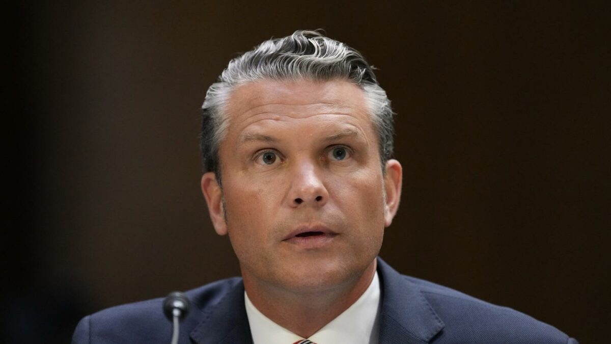 Defense Secretary Pete Hegseth sits and speaks at a Senate Committee Hearing