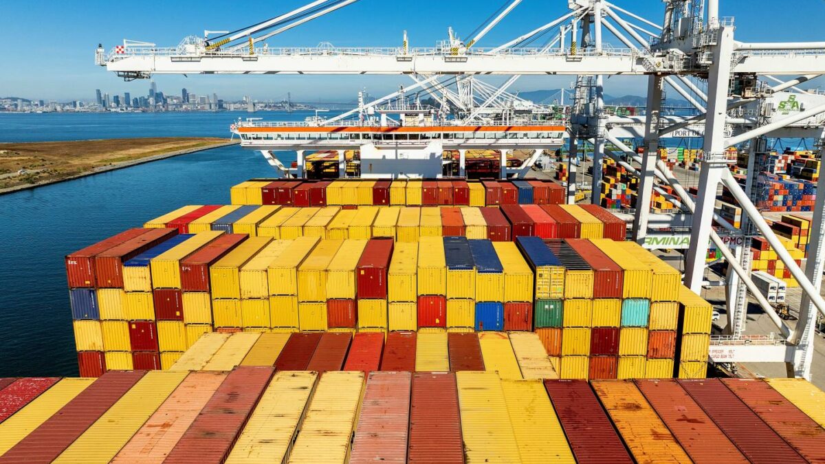 Cargo containers line a ship at the Port of Oakland on Wednesday, Aug. 6, 2025.