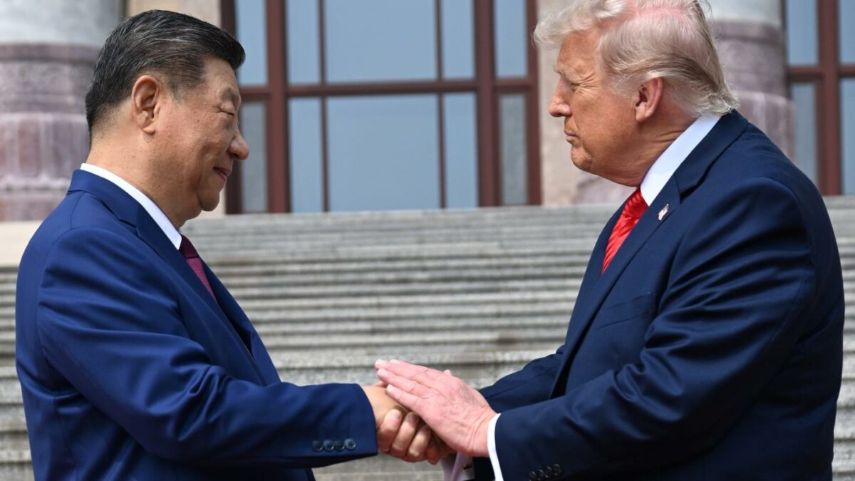 Chinese President Xi Jinping, left, shakes hands with President Donald Trump at the Great Hall of the People in Beijing, May 14, 2026.