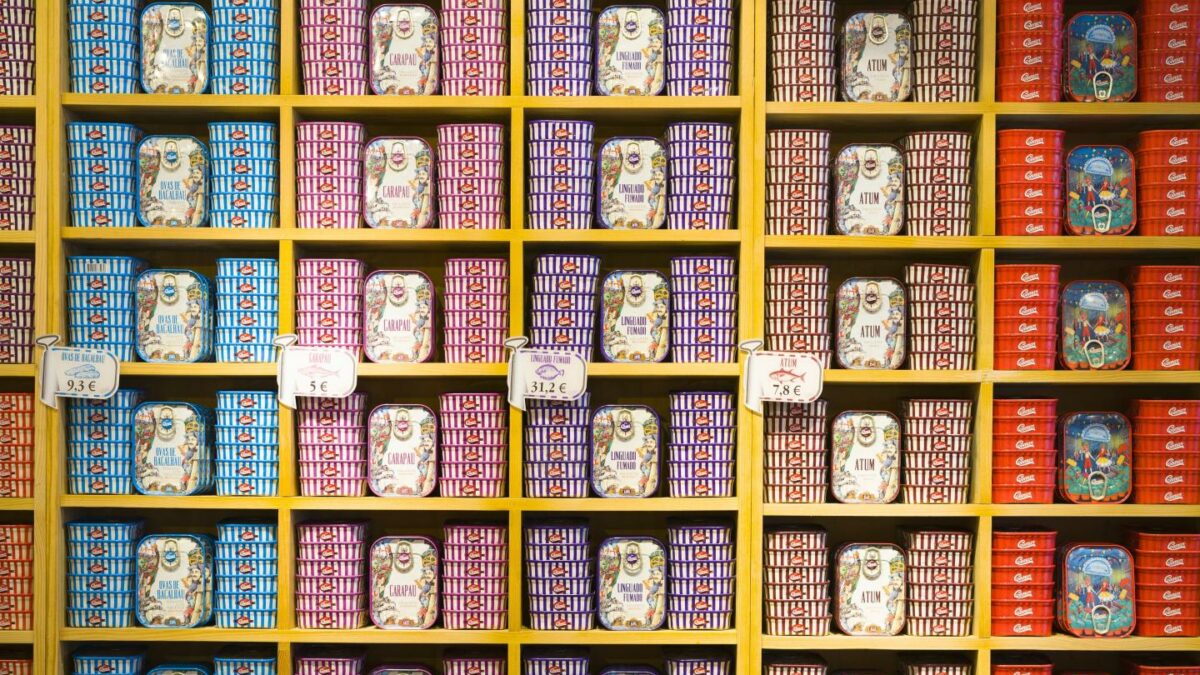 Cans of fish stacked on shelves