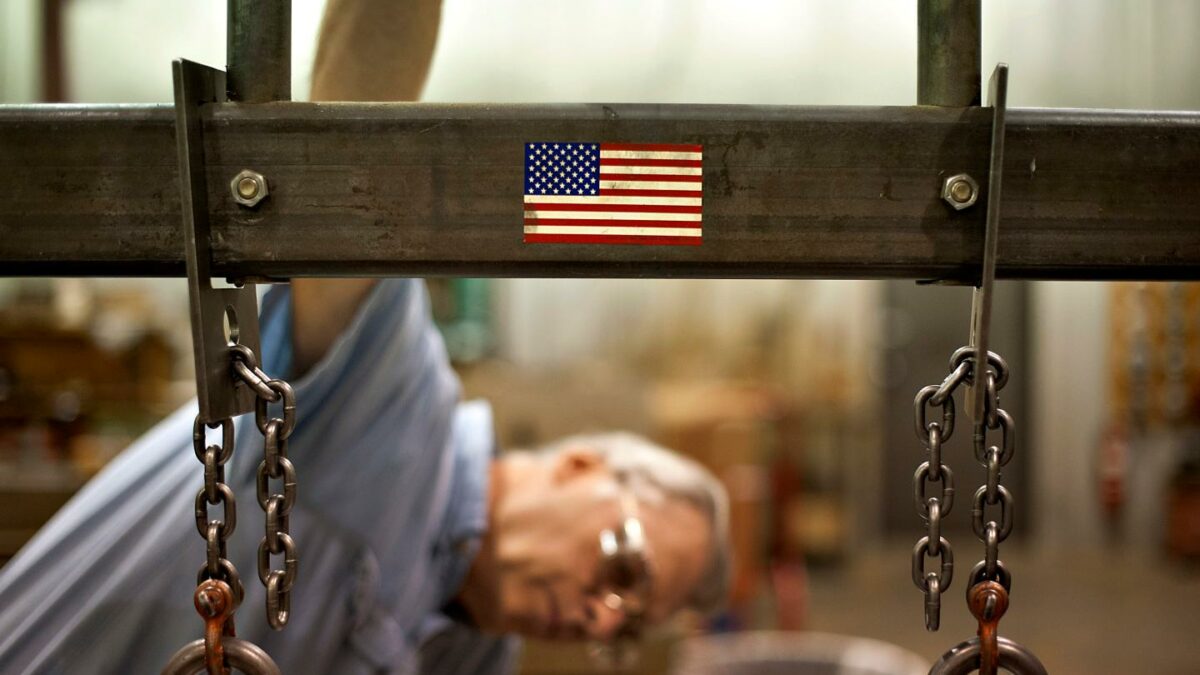 Employee William Meznarich reassembles the die for a punch press at the Badge-A-Minit facility in Oglesby, Illinois, U.S., on Friday, June 29, 2012.