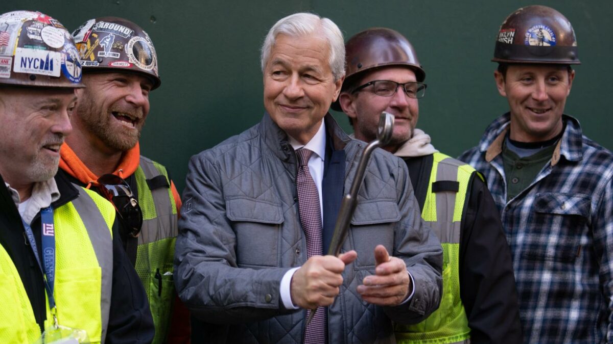 Jamie Dimon surrounded by construction workers.