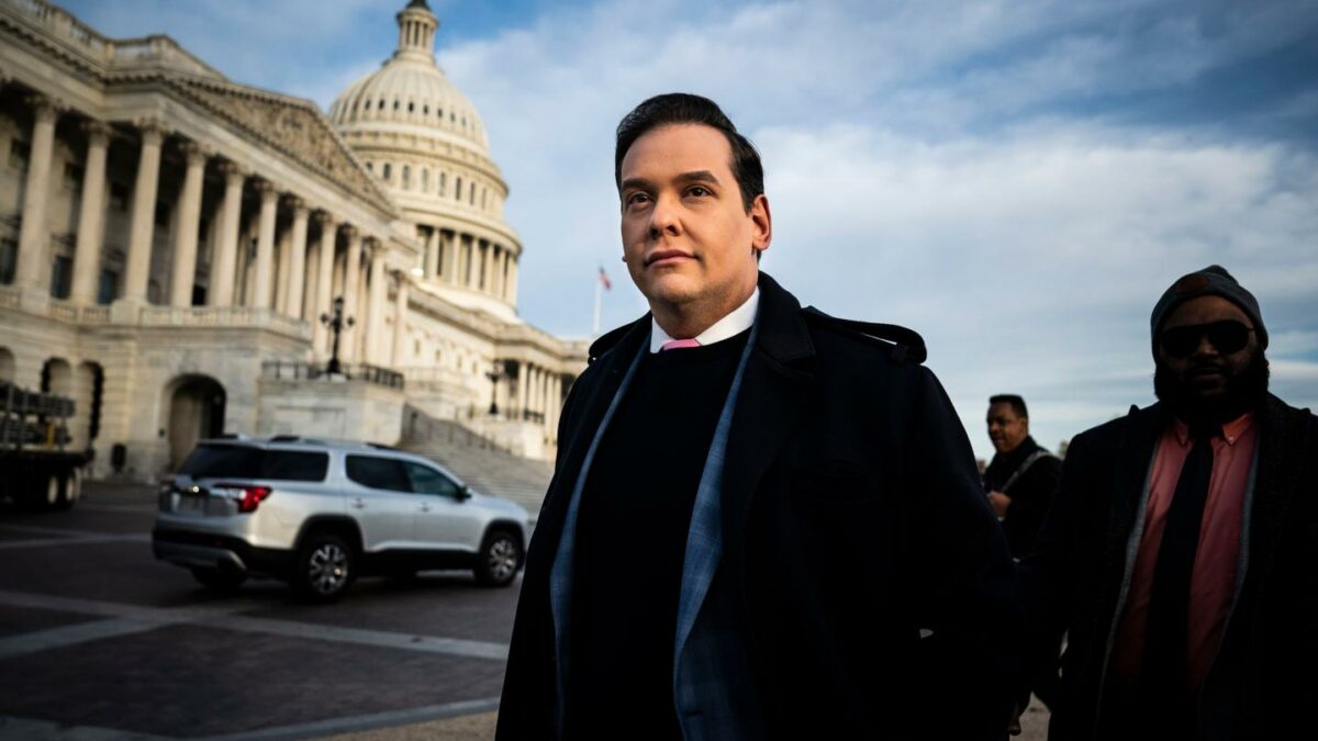 George Santos stands in front of the US Congress on Capitol Hill.