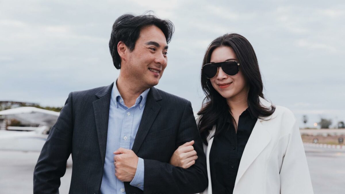 Rich couple walking