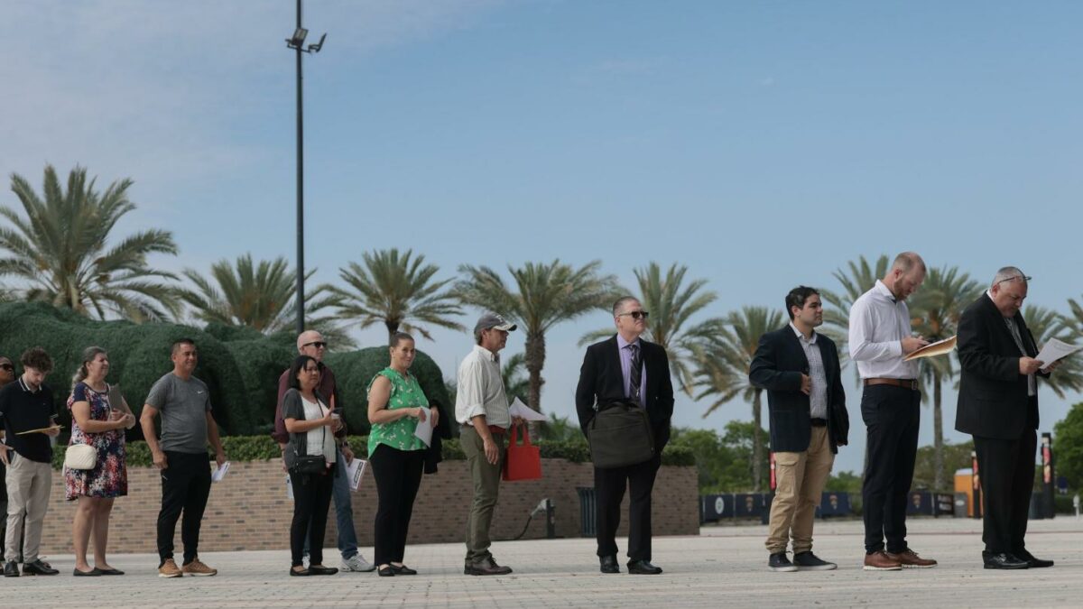 Job seekers wait in line to enter the Mega JobNewsUSA South Florida Job Fair on April 30, 2026, in Sunrise, Fla.