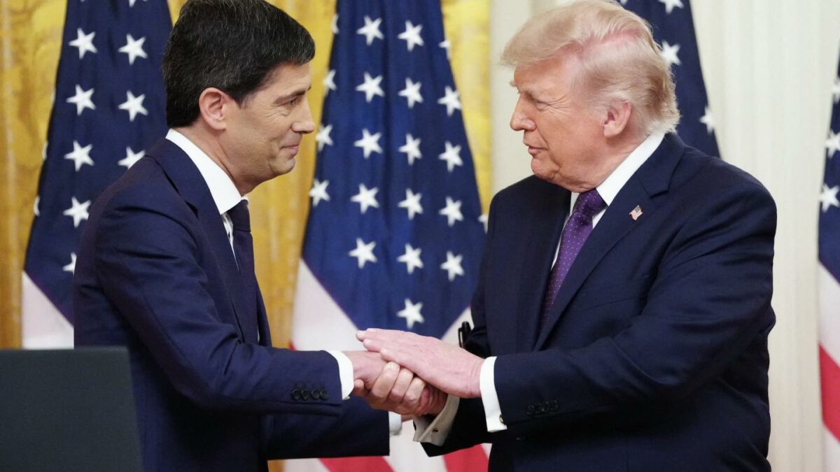 S President Donald Trump shakes hands with the new Chairman of the Federal Reserve Kevin Warsh (L) during a swearing in ceremony in the East Room of the White House in Washington, DC on May 22, 2026.