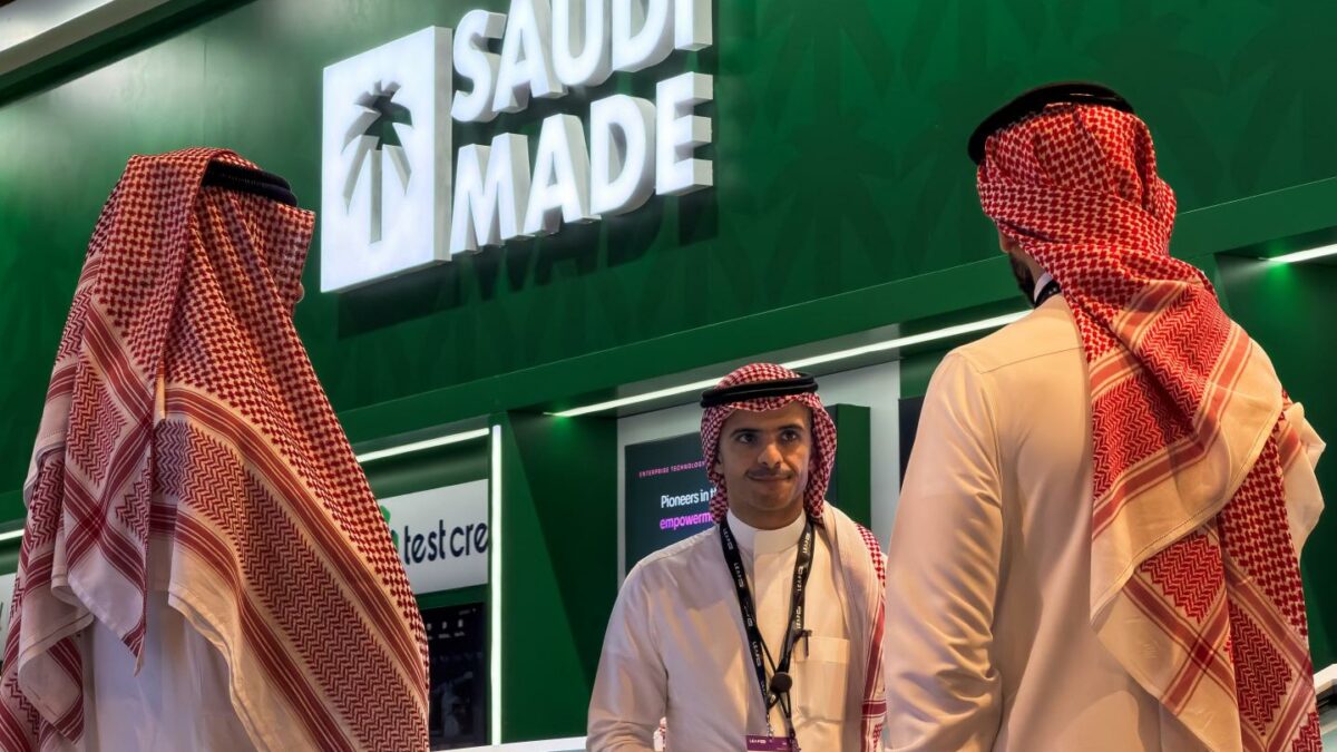Saudi representatives stand by the Saudi Made pavilion, which showcases the kingdom's technology companies and innovation initiatives, while attending LEAP East 2026 in Hong Kong, the first Asia-Pacific edition of the Saudi-born LEAP technology conference.