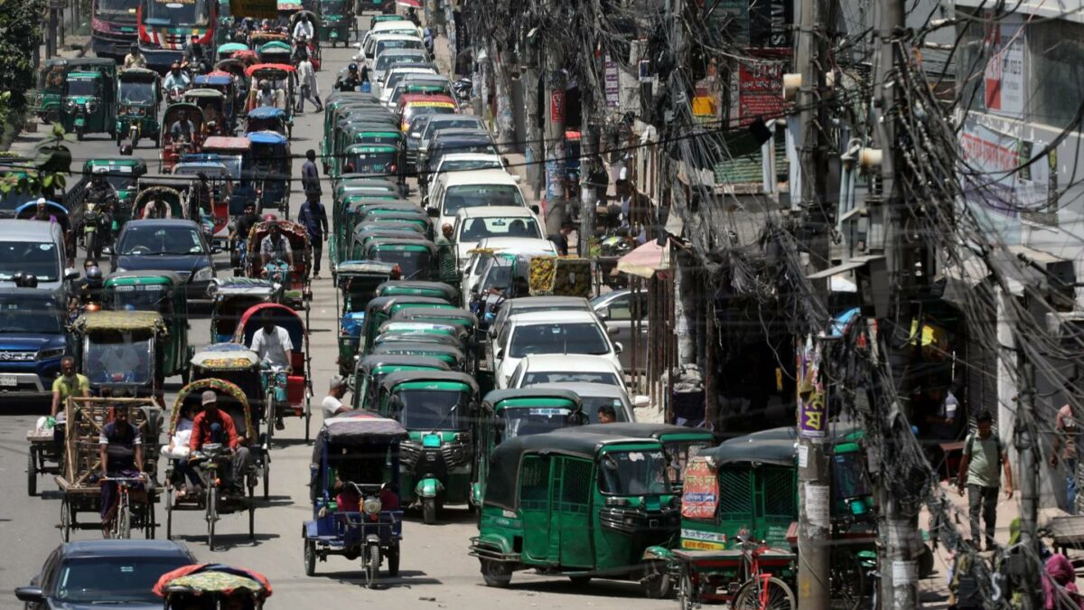 Rickshaws and vehicles wait in long queues outside a filling station in Dhaka, Bangladesh, July 25, 2026.