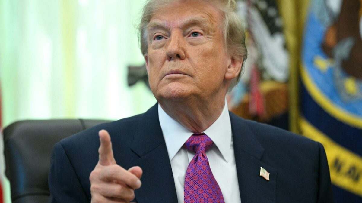 US President Donald Trump speaks after signing an executive order that aims to rename Lake Ontario to Lake America in the Oval Office of the White House in Washington, DC.
