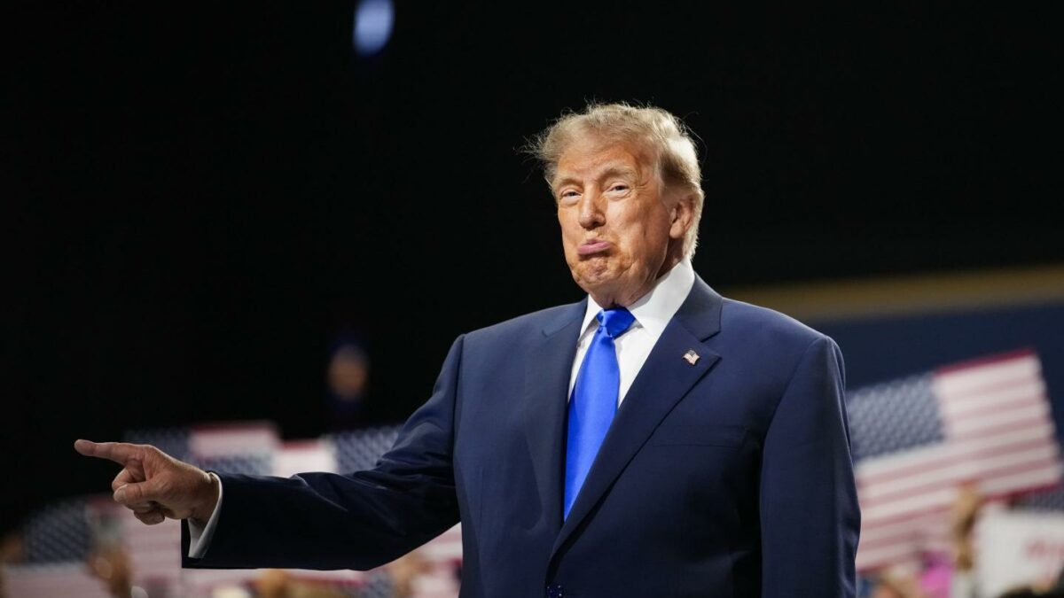 U.S. President Donald Trump walks on stage to speak on the first day of the 2026 Republican National Convention at the American Airlines Center.