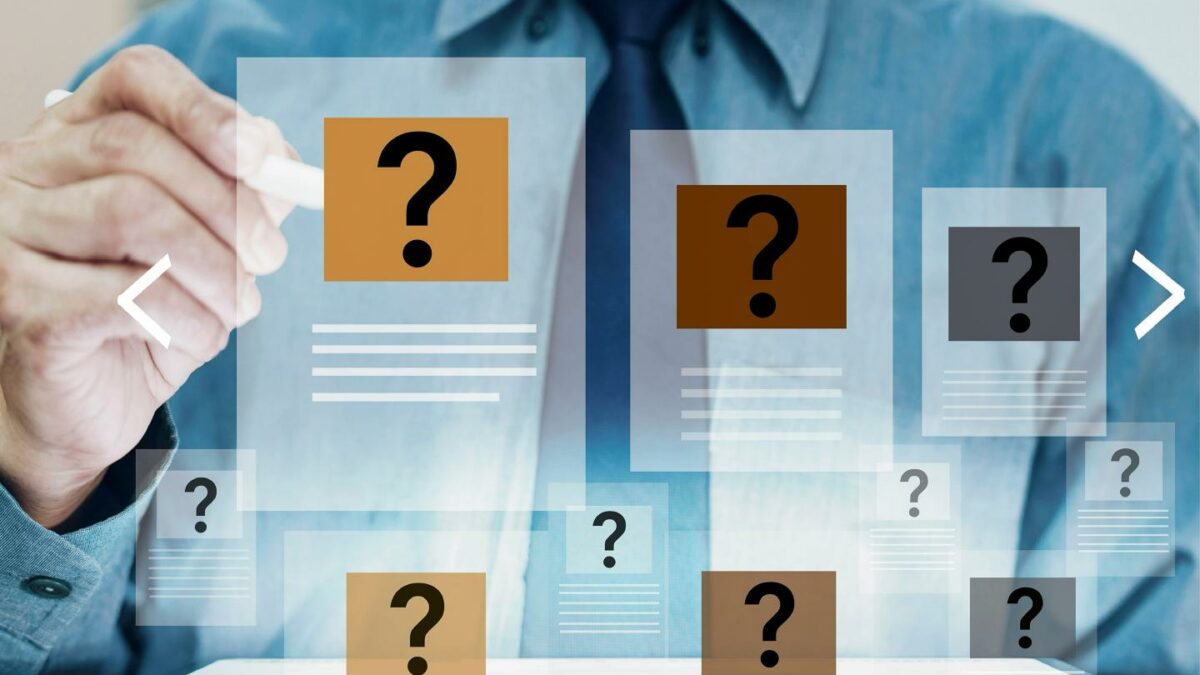 A person working on a panel with a question mark.